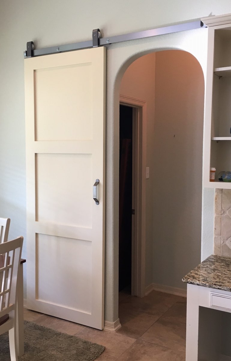 Shaker style barn door in Salt Lake City kitchen.